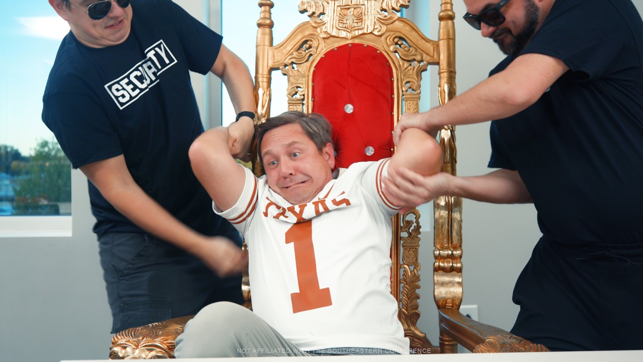 illustration of two guys in all black trying to remove guy in Texas jersey off of the throne
