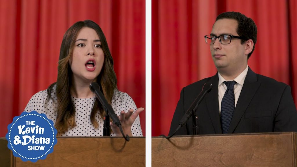 man and woman at debate stage