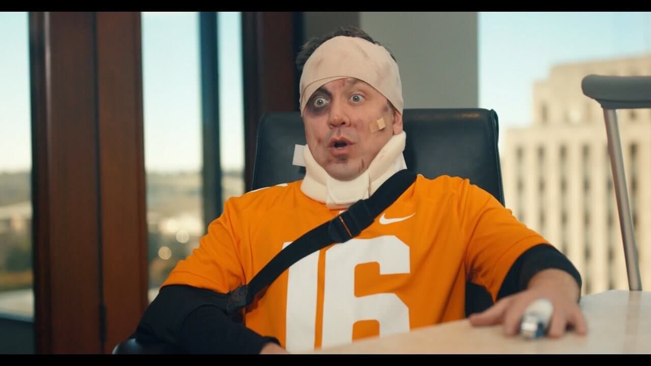 Injured Tennessee sitting at a conference table