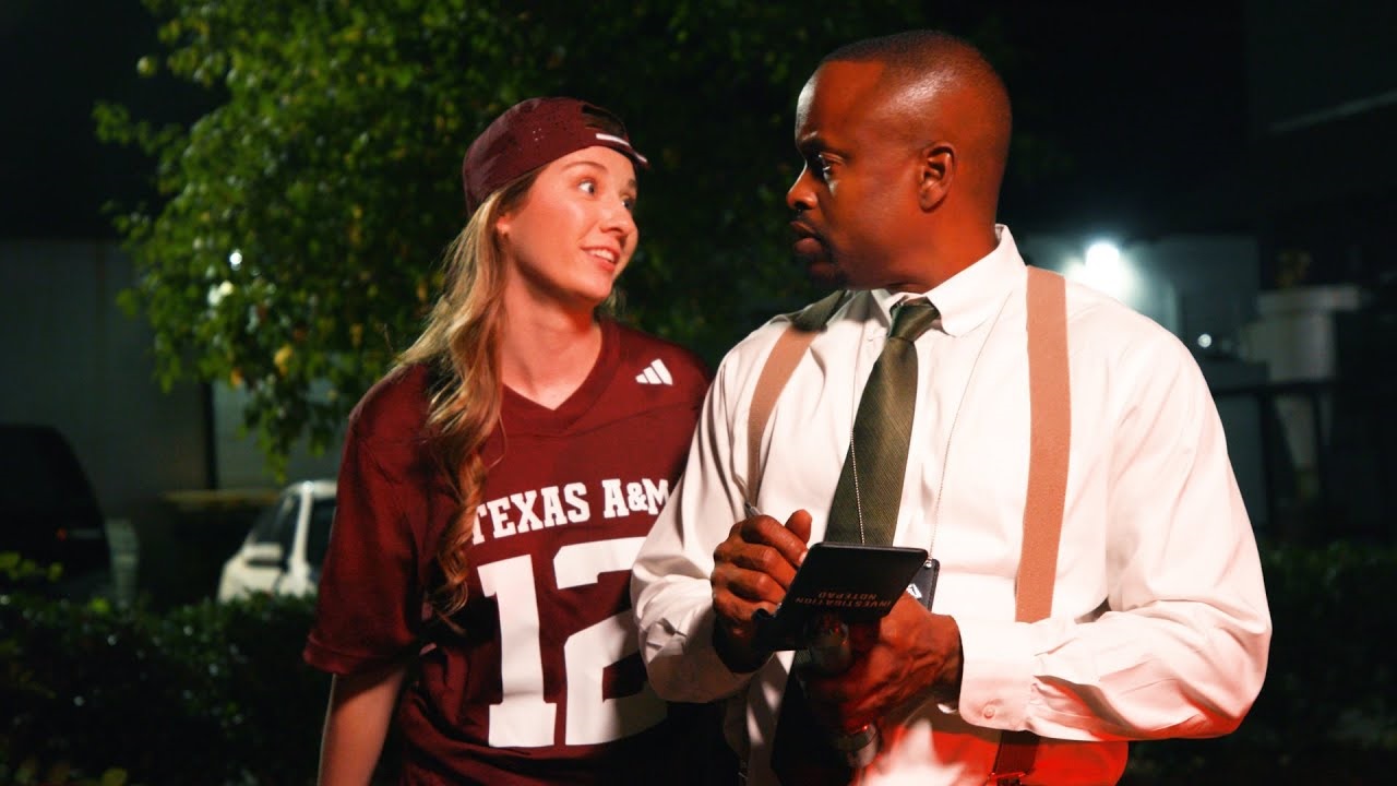 Girl in a Texas A&M Jersey next to a guy with a white shirt and tie