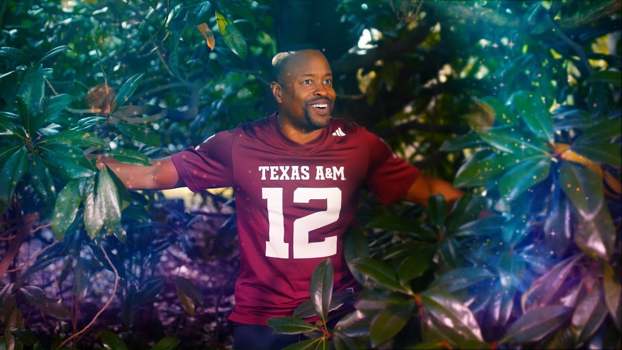 Man in Texas A&M jersey coming out of the woods
