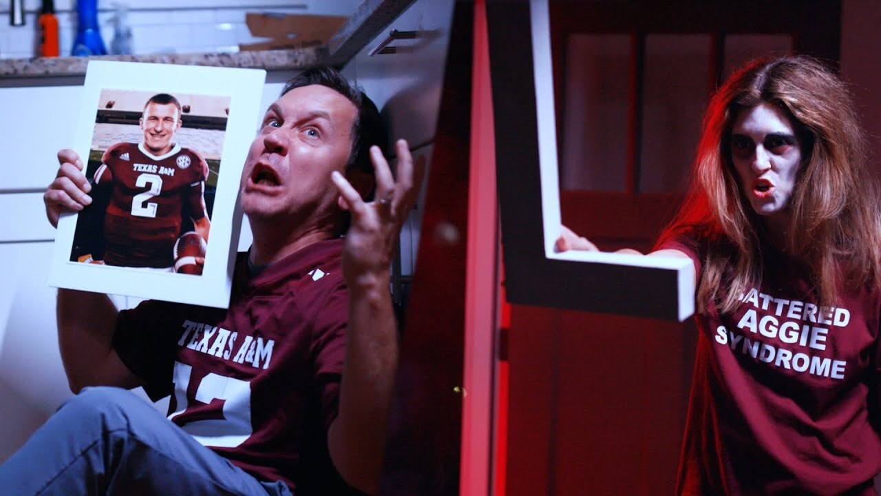 guy with a Texas A&M jersey holding up a photo of one of the A&M players