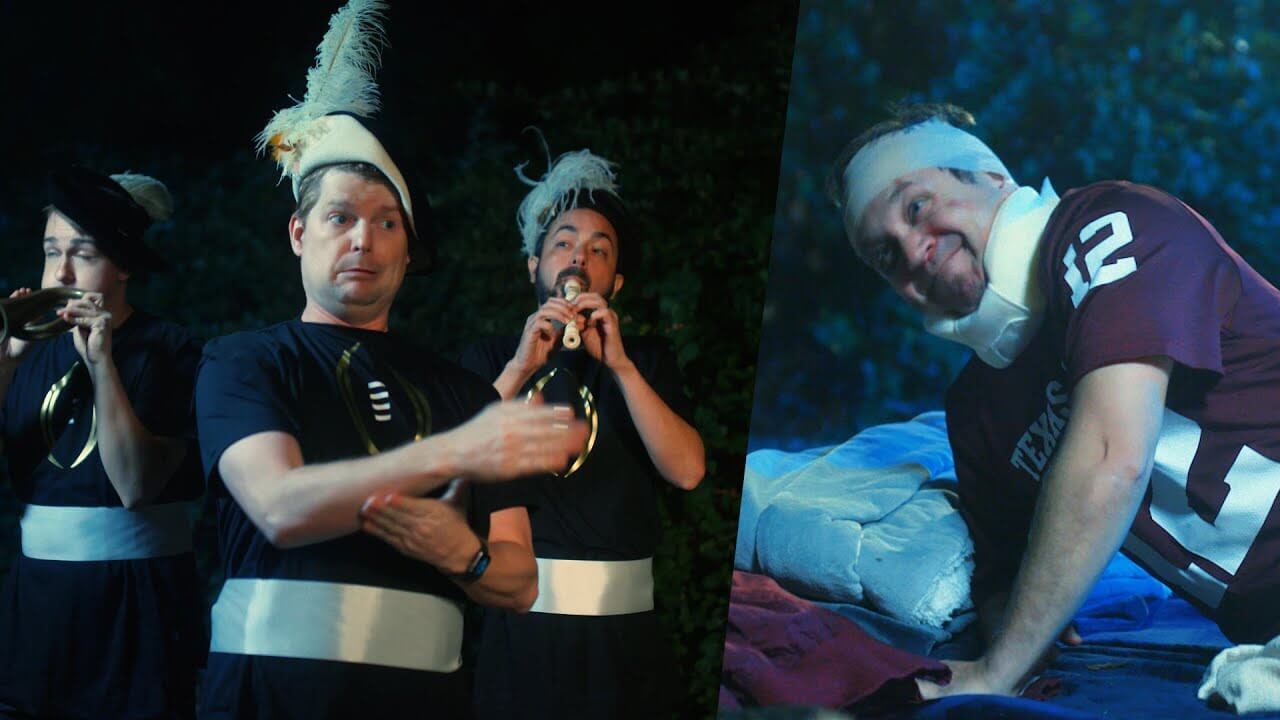 Three guys playing instruments, one guy injured laying down