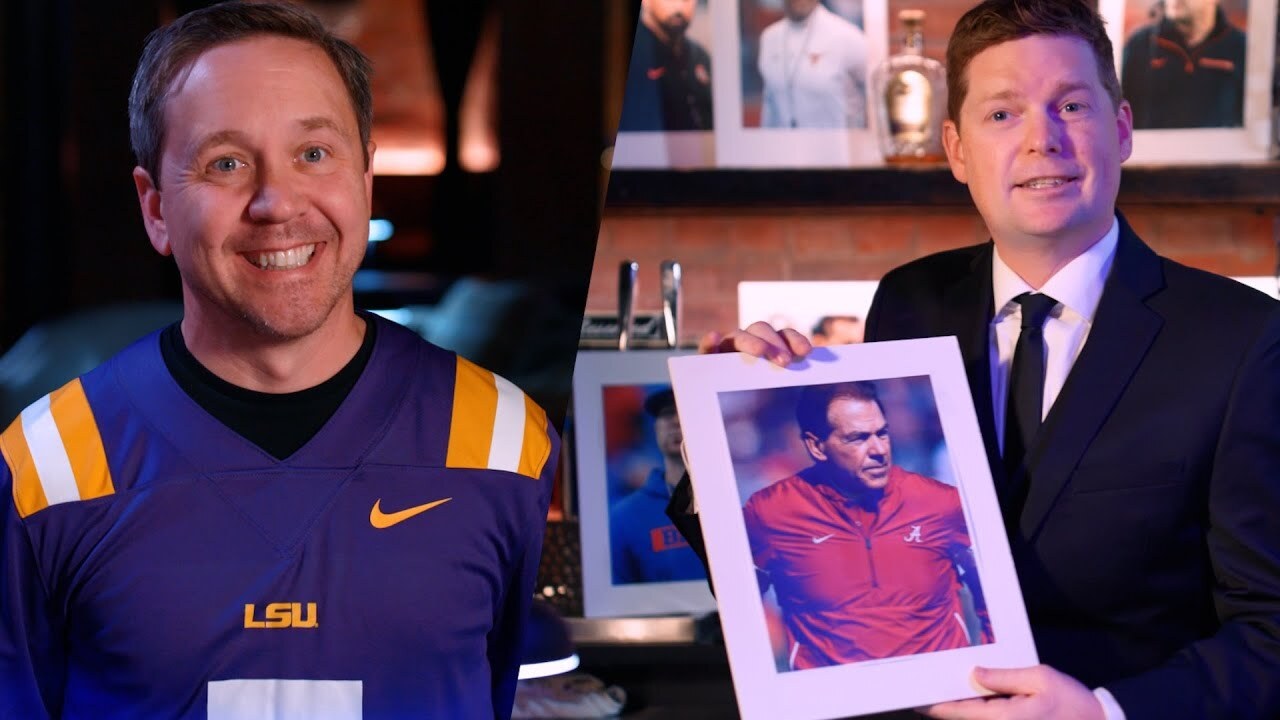 guy in a suit holding a photo of Nick Saban and a guy in an LSU jersey