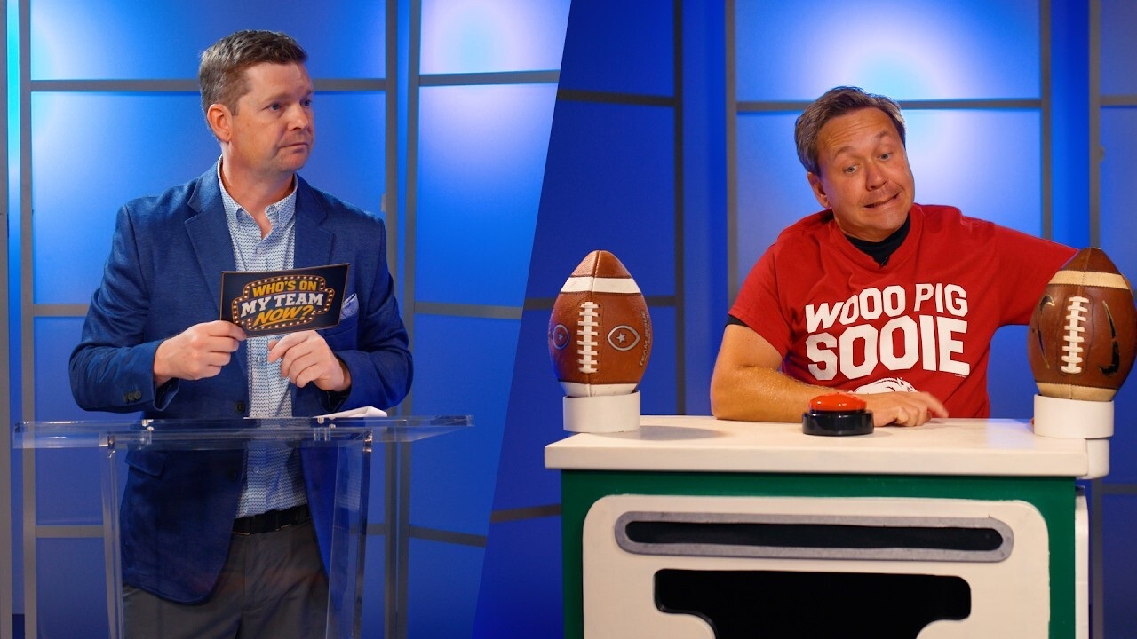 a game show host and a contestant with a red shirt on that says "Woo pig sooie"
